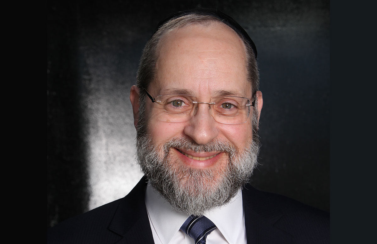 Head shot of Rabbi Chaim Trainer smiling